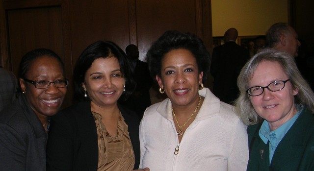 Friends and colleagues congratulate Loretta (in white dress) after her 2010 installation as U.S. Attorney.